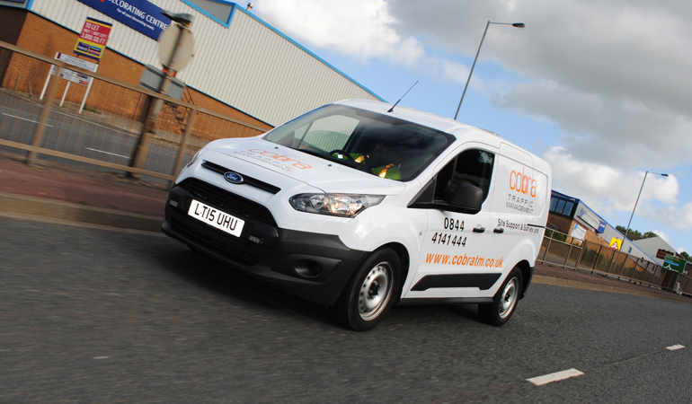 A member of the Cobra Traffic Management site survey team heads to a meeting with clients